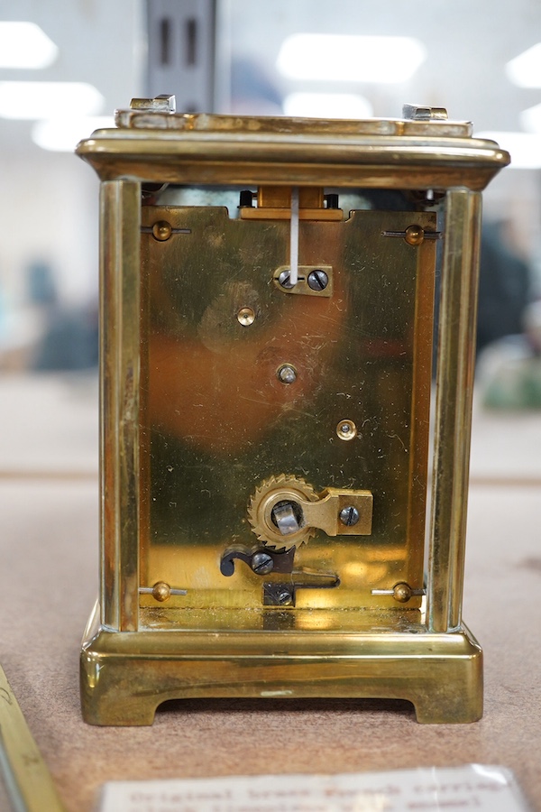 A late 19th century French brass cased eight day carriage timepiece with key, 14cm high. Condition - poor, untested